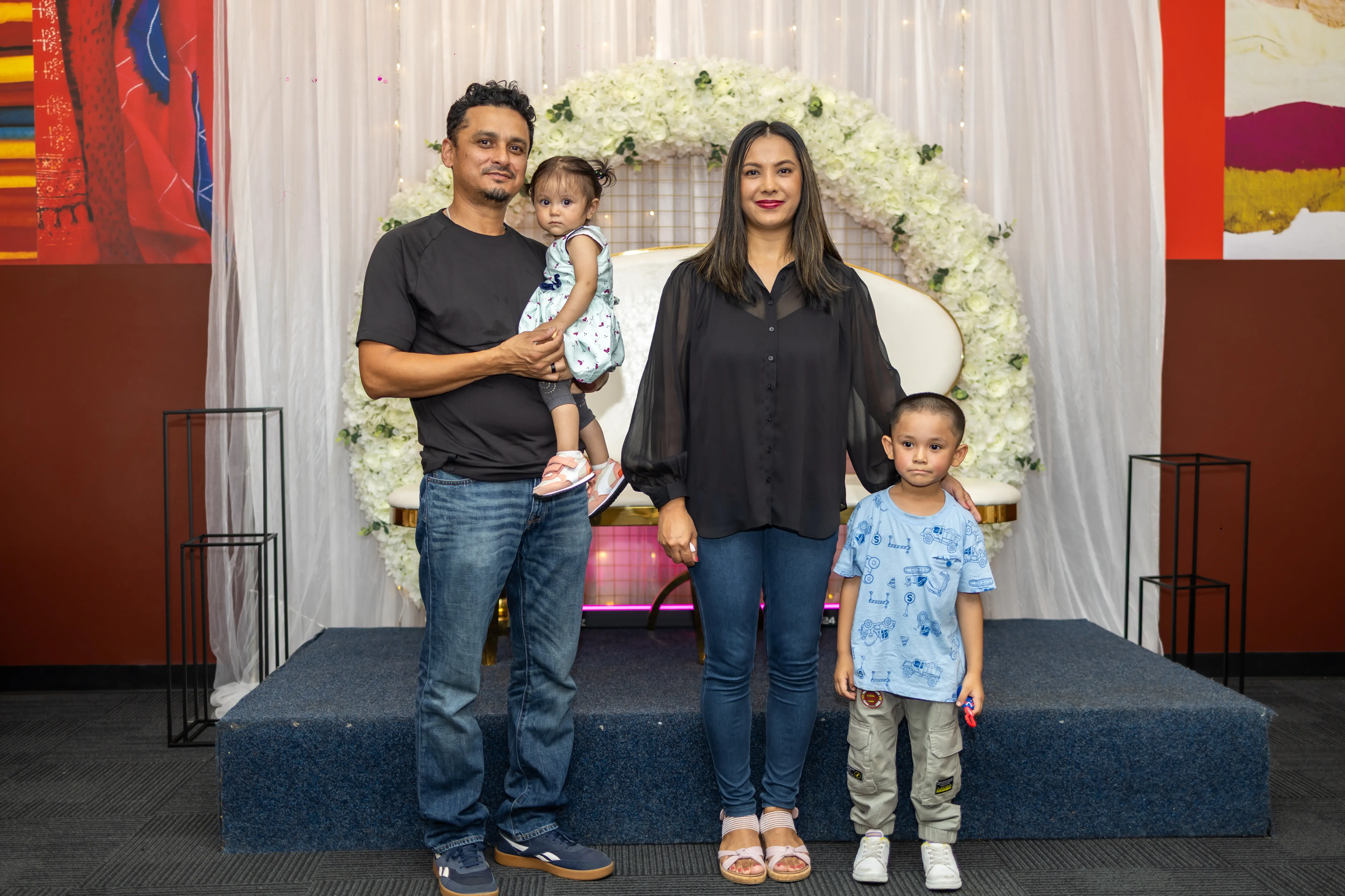 A family posing for a photo in semi-formal attire during a family function at Third Eye Windsor, 515 George St, South Windsor NSW 2756.